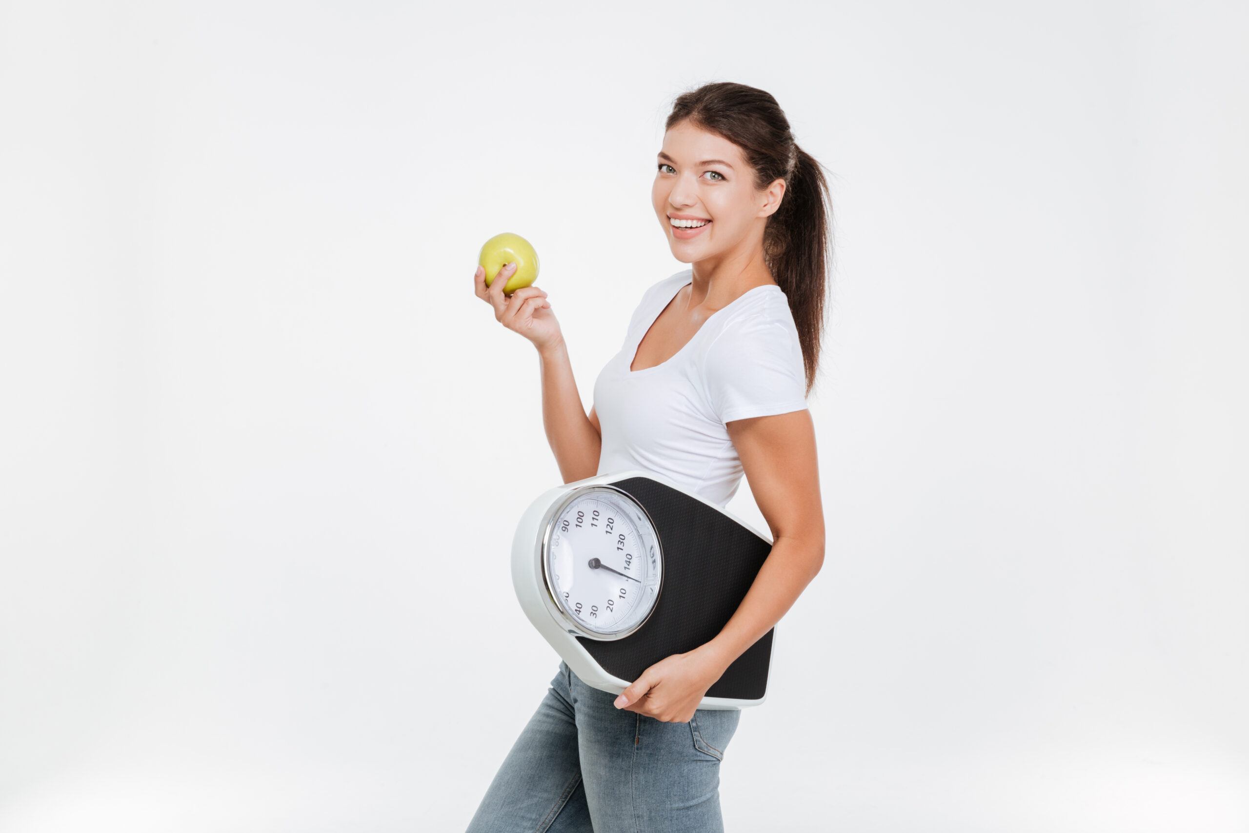 Woman Holding Scale And Apple